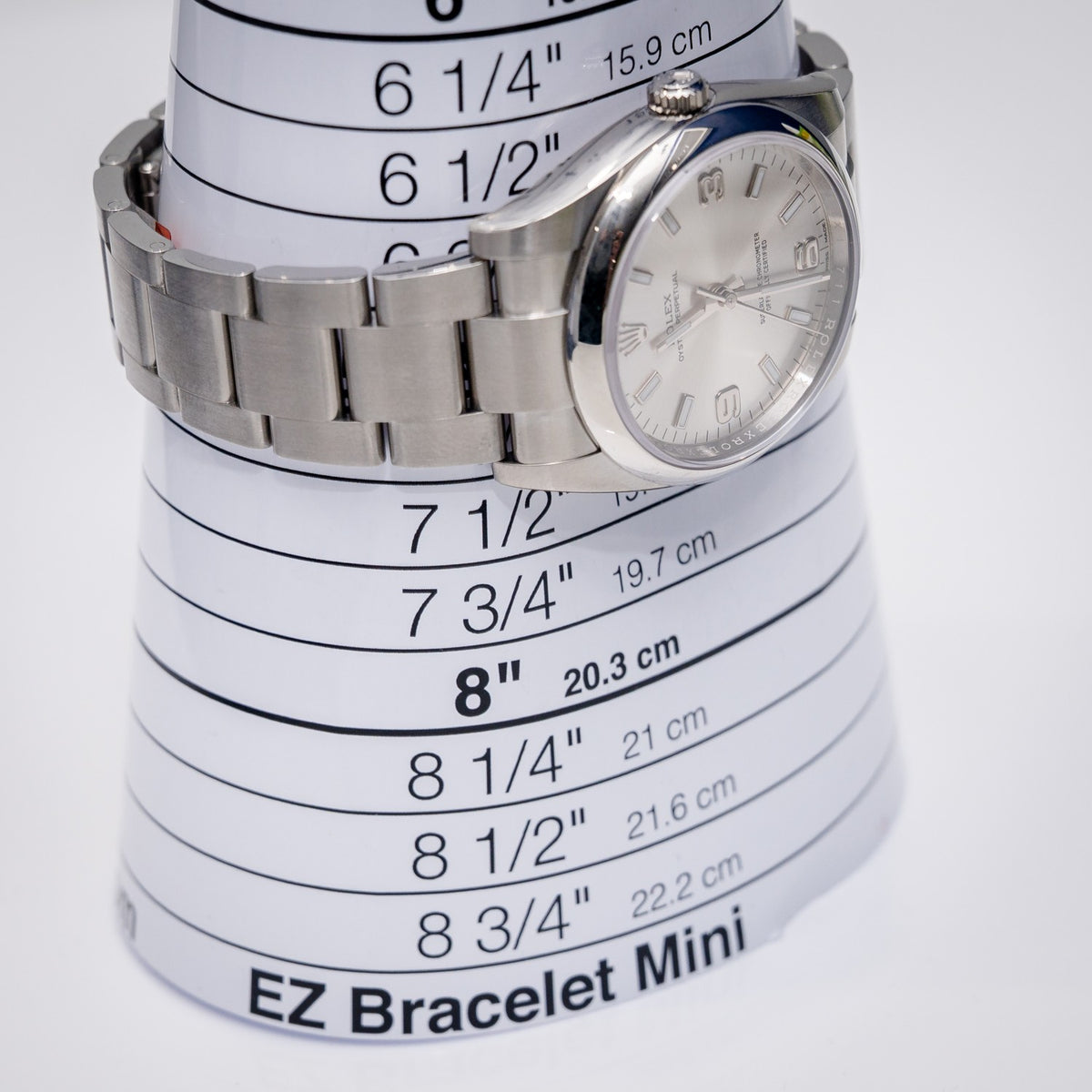 Rolex Oyster Perpetual 114200 Steel Silver Arabic Numerals Dial – detail